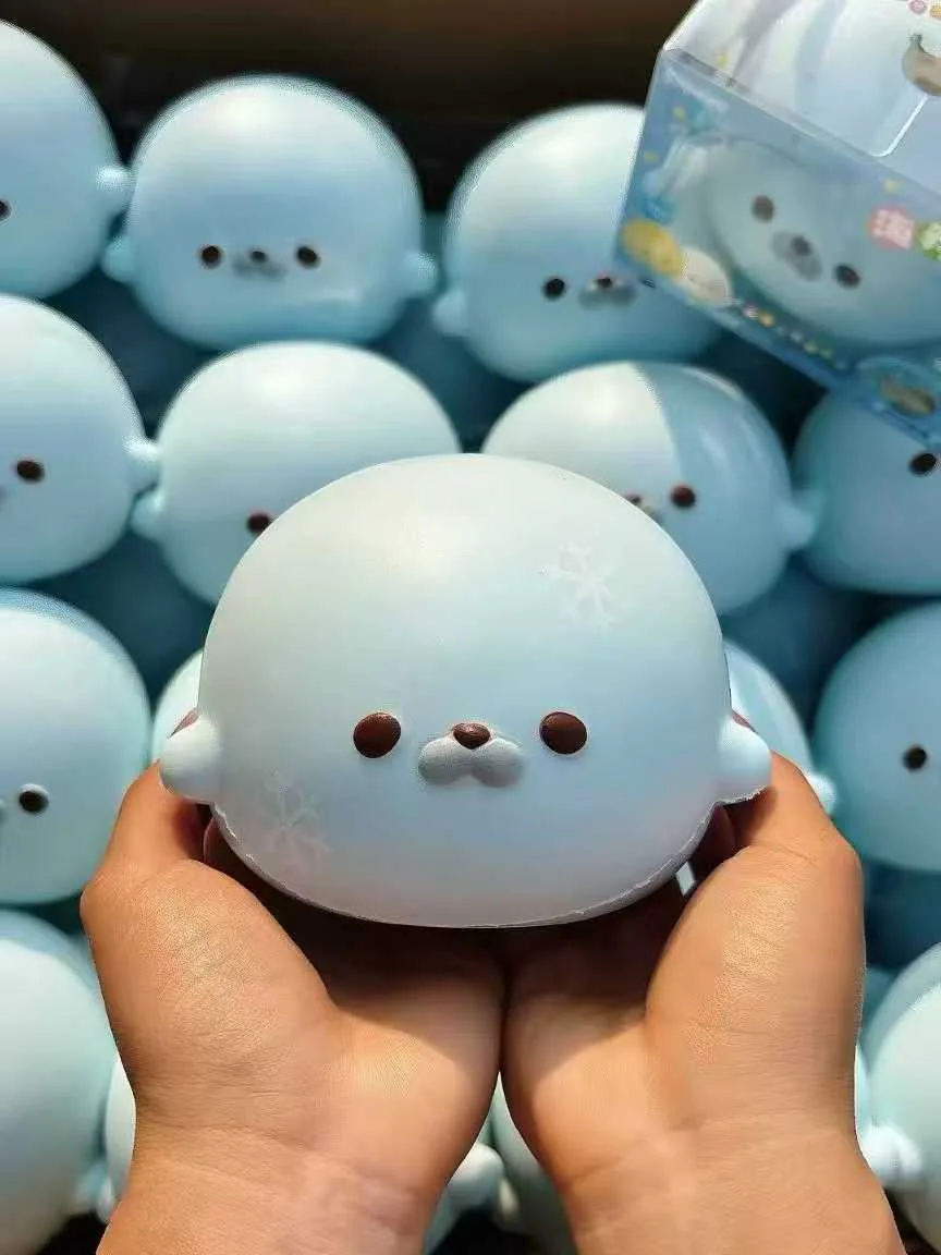 Blue character squishy with rounded ears and a smiling face